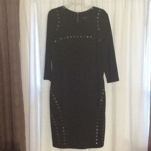 Black ponte knit grommet dress by Tribal.